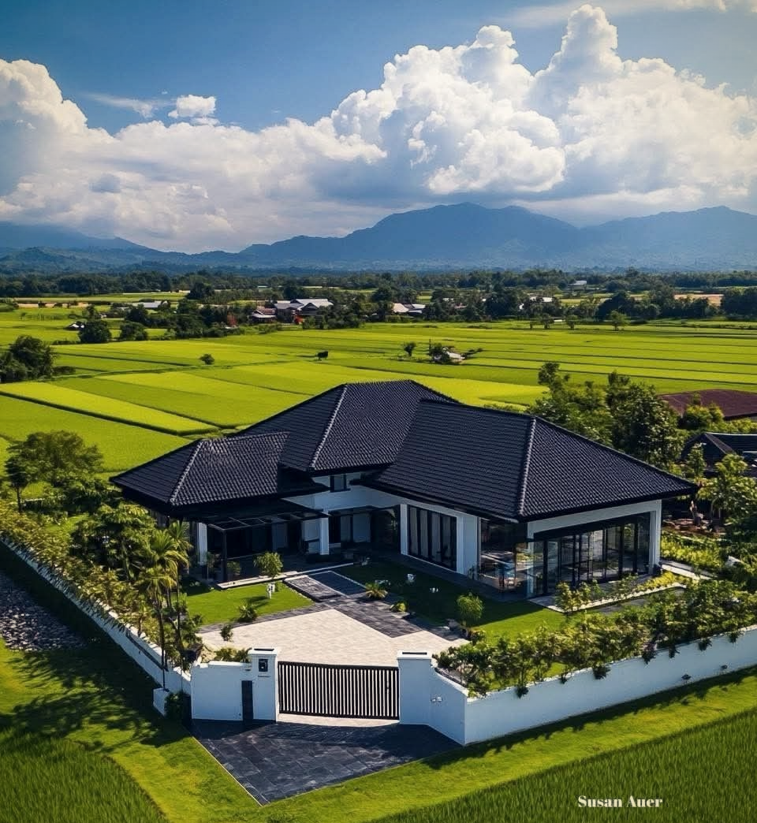 The Saikia Bungalow — modern Assam home with sloped tiled roof, paddy fields and Patkai foothills in Dibrugarh